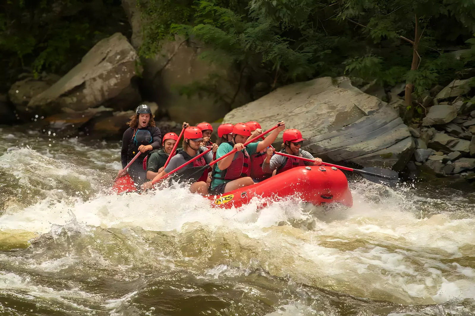 whitewater rafting through rapids