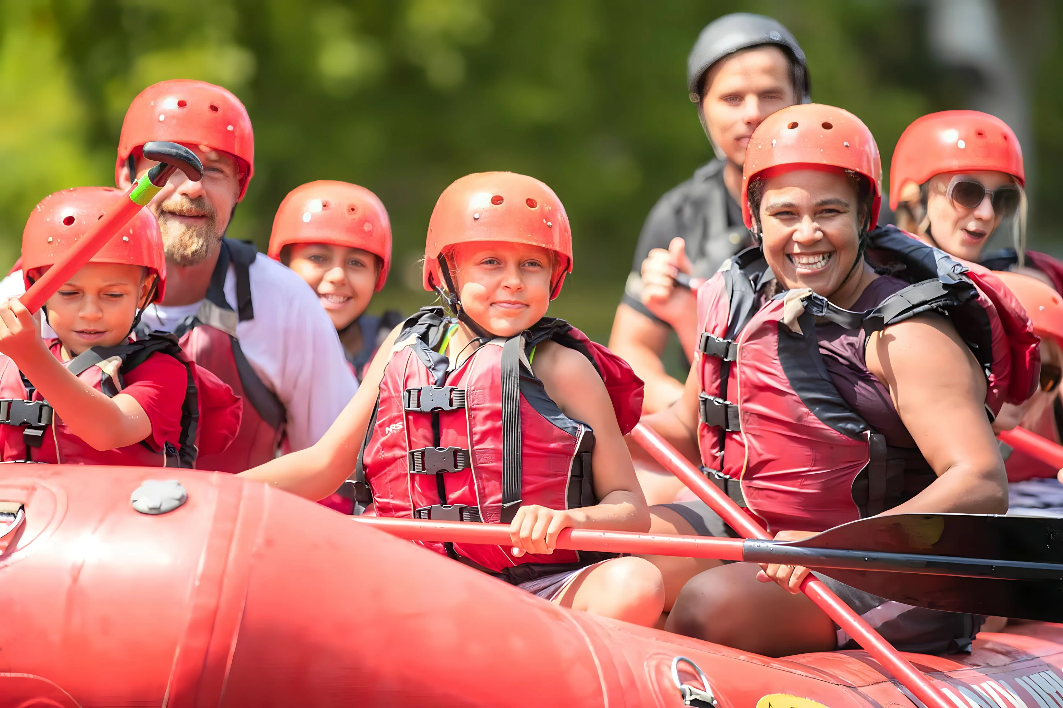 white water raft with young rafters