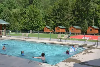 outdoor pool and jumping pillow at Pigeon River Campground