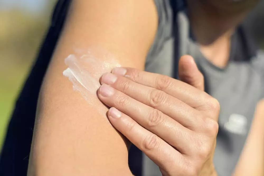 Closeup,Of,A,Young,Caucasian,Man,Wearing,A,T-shirt,Applying