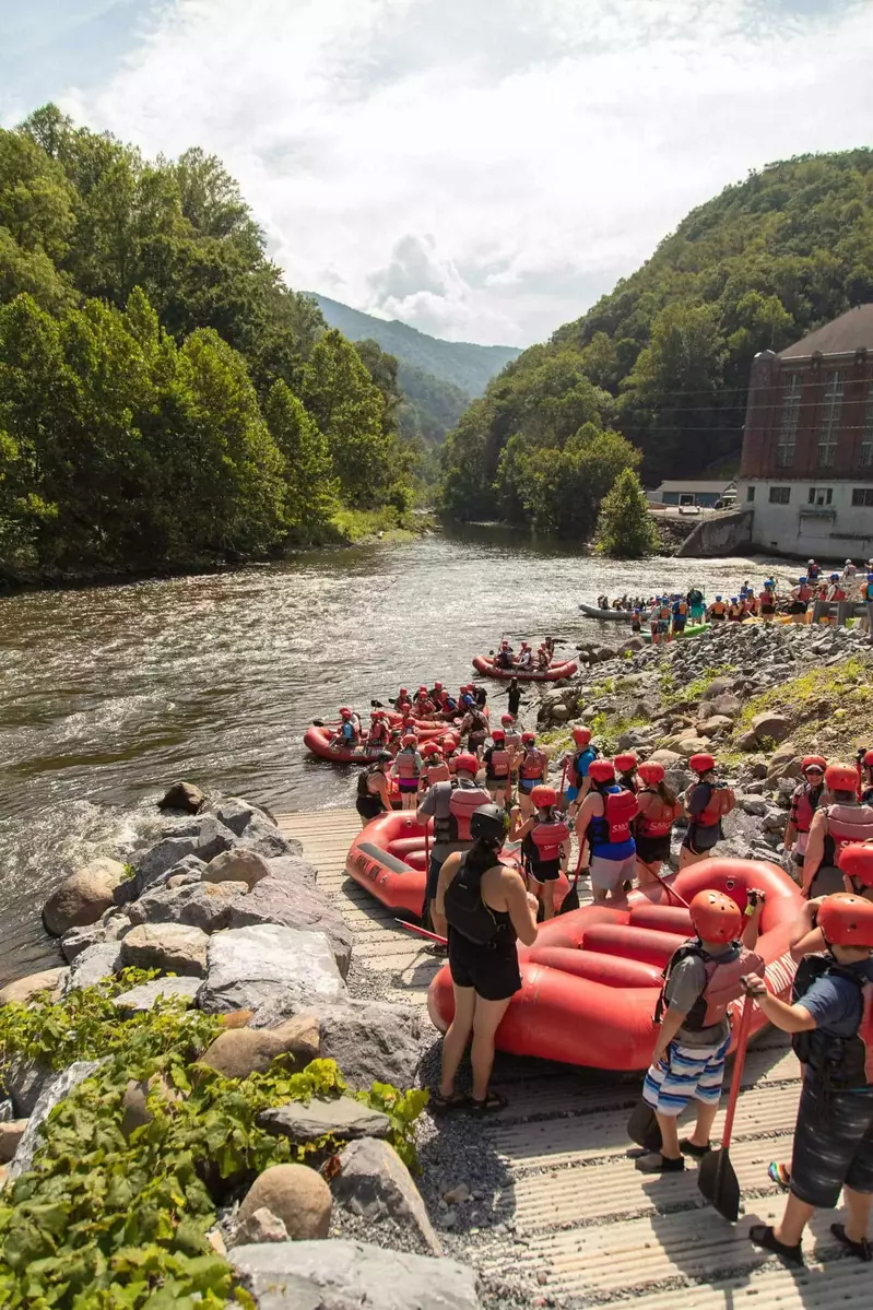 people waiting to get in the river on their raft