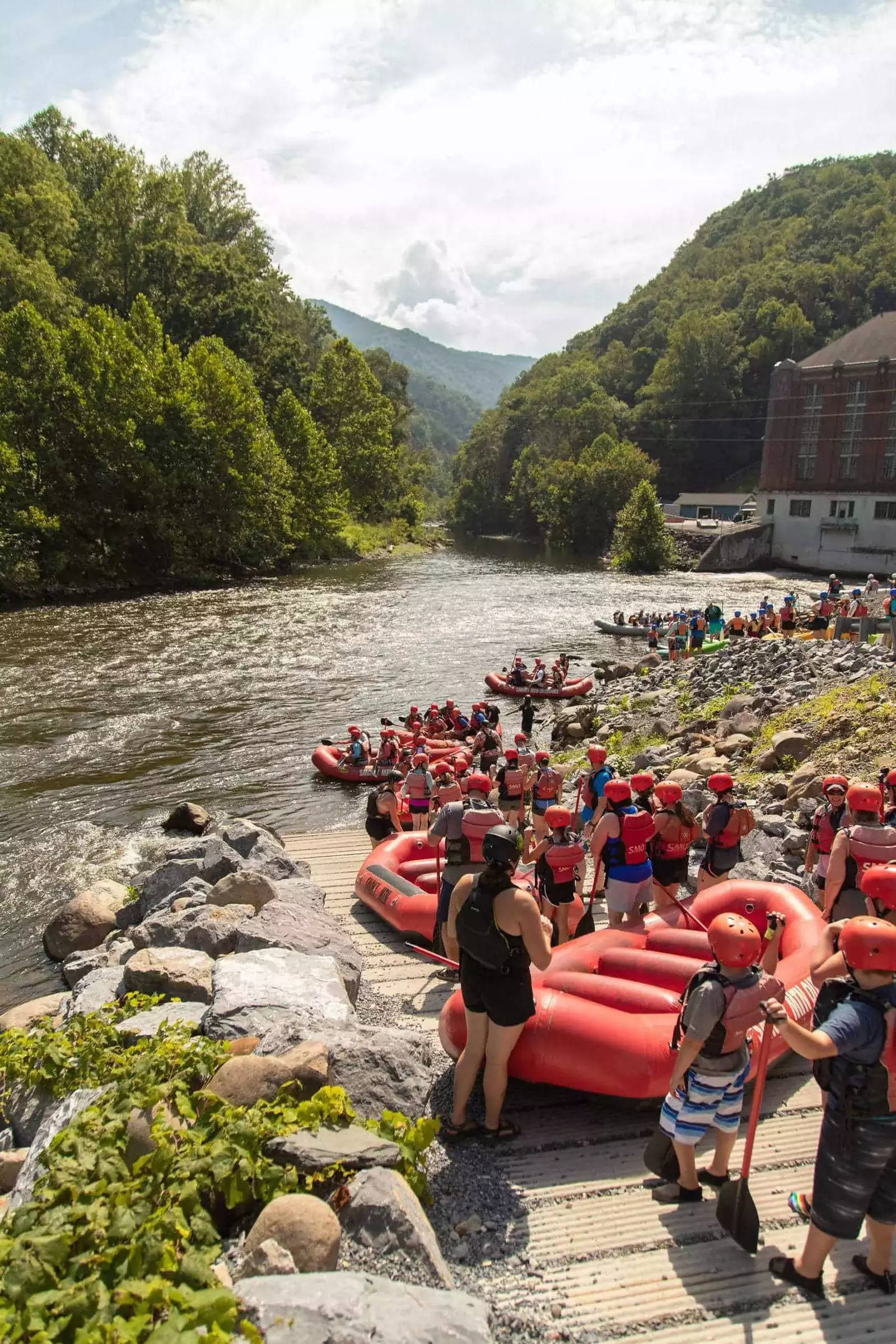people waiting to get in the river on their raft