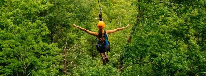 girl ziplining in the smoky mountains