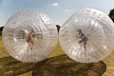 Two boys in Zorb balls.