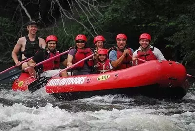 Family having fun on their Lower Pigeon River rafting trip.