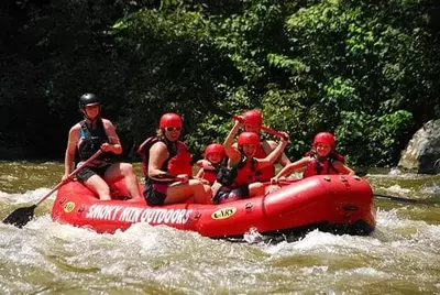Happy family enjoying Gatlinburg white water rafting