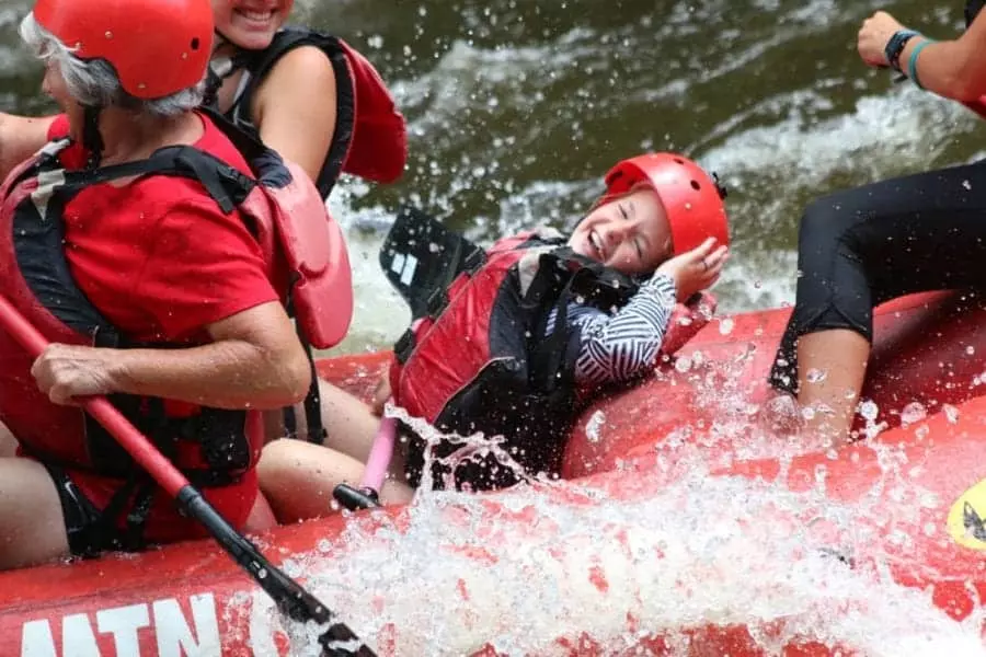 kid laughing in a raft