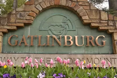 Gatlinburg sign with spring flowers