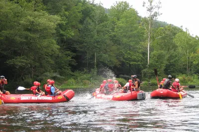 group of rafts having splash battle on Pigeon River