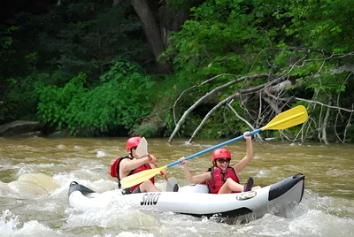 Parent and child kayaking in Gatlinburg.