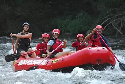 A family whitewater rafting