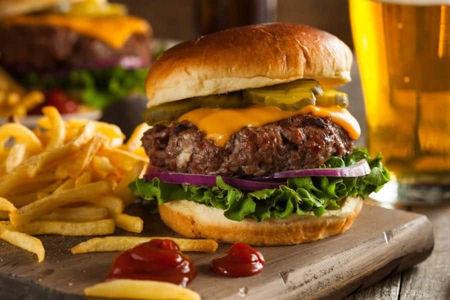 A delicious cheeseburger with french fries.