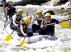 groups of people white water rafting in the Smoky Mountains