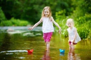 two sisters playing in the Little Pigeon River