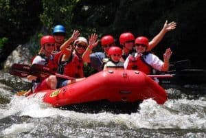 Guests enjoying a white water rafting trip