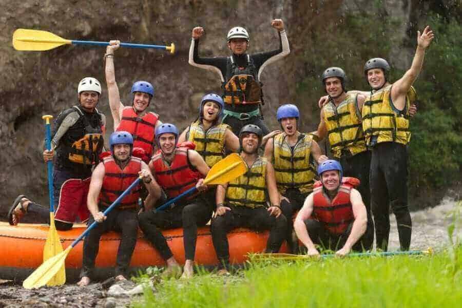 Large group of people ready to go white water rafting