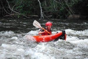 Boy enjoying a kayak ride