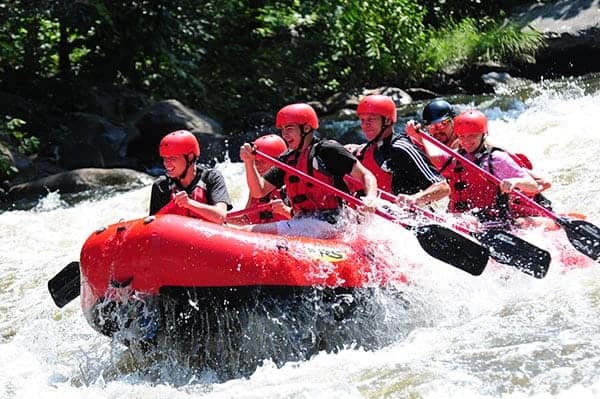 Excited people rafting on the Pigeon River in Tennessee