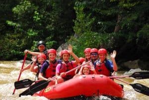 Happy family rafting the Pigeon River