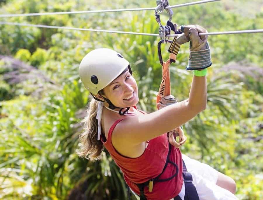 A woman ziplining in Gatlinburg, part of our special combo package
