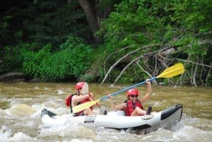 Parent and child kayaking in Gatlinburg.