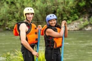 couple enjoying a Pigeon River whitewater rafting adventure