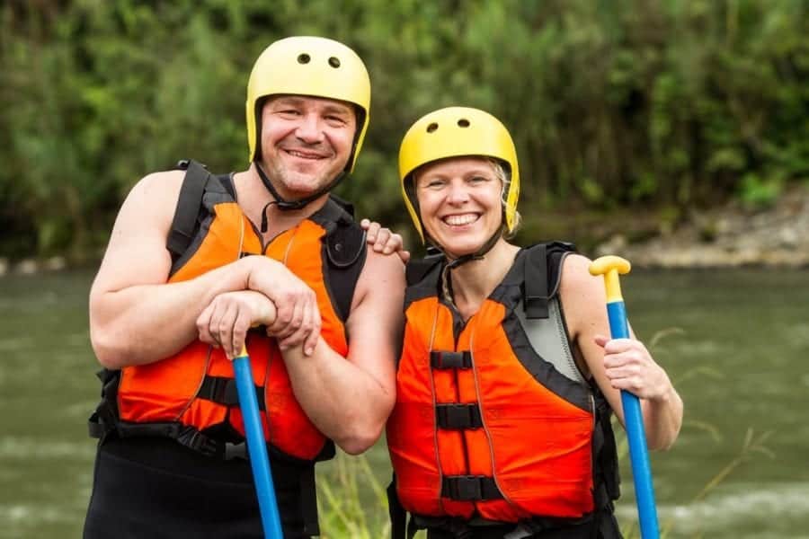 couple wearing sunscreen ready for a Pigeon River whitewater rafting adventure