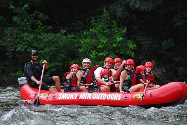 A large family enjoying Smoky Mountains white water rafting.