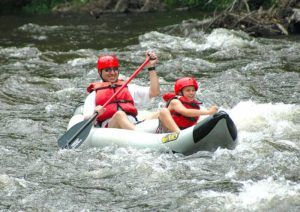 Man and boy kayaking in Smoky Mountains