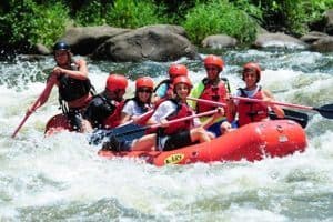 A family white water rafting on the Pigeon River.