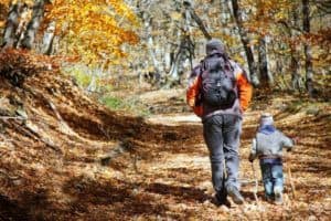 A father and son hiking in the Smoky Mountain in the fall.
