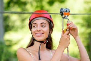 A woman preparing to go ziplining.