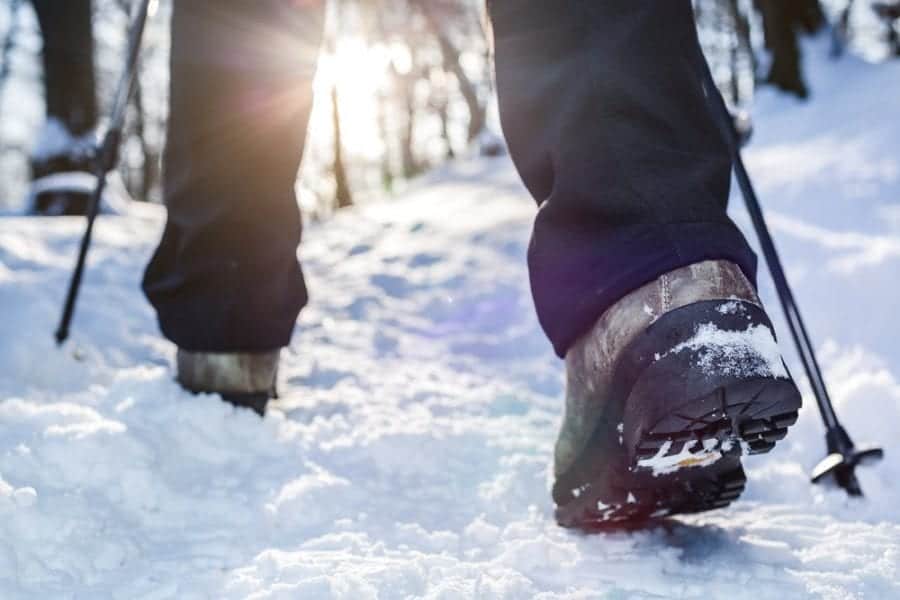 hiking boots on snowy trail