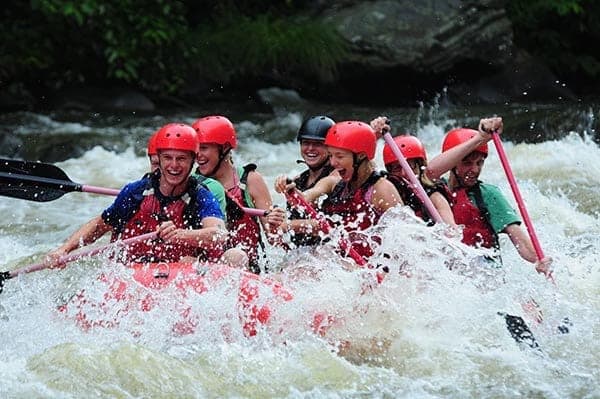 A happy group of people Pigeon Forge rafting.