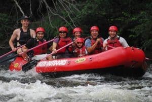 Family having fun on their Lower Pigeon River rafting trip.
