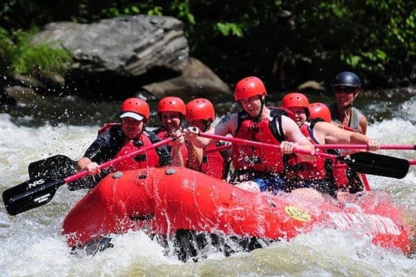 A group of friends enjoying the best white water rafting in Gatlinburg TN.