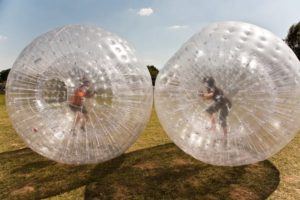 Two boys in Zorb balls.