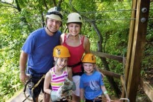 A family preparing to go ziplining.