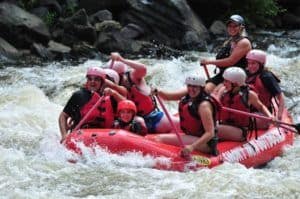 A family on a white water rafting adventure in Gatlinburg.