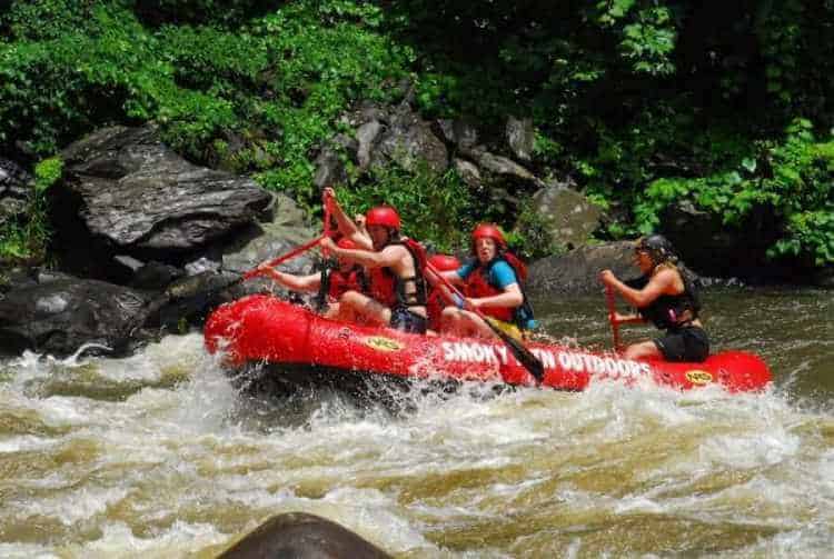 A group of people Great Smoky Mountain white water rafting.
