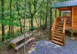 A cabin next to the water at Pigeon River Campground near Gatlinburg TN.