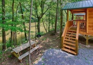 A cabin next to the water at Pigeon River Campground near Gatlinburg TN.