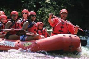 Happy group of people rafting in the Smoky Mountains.