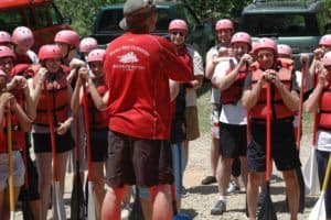 Group of rafters listening to guide before trip