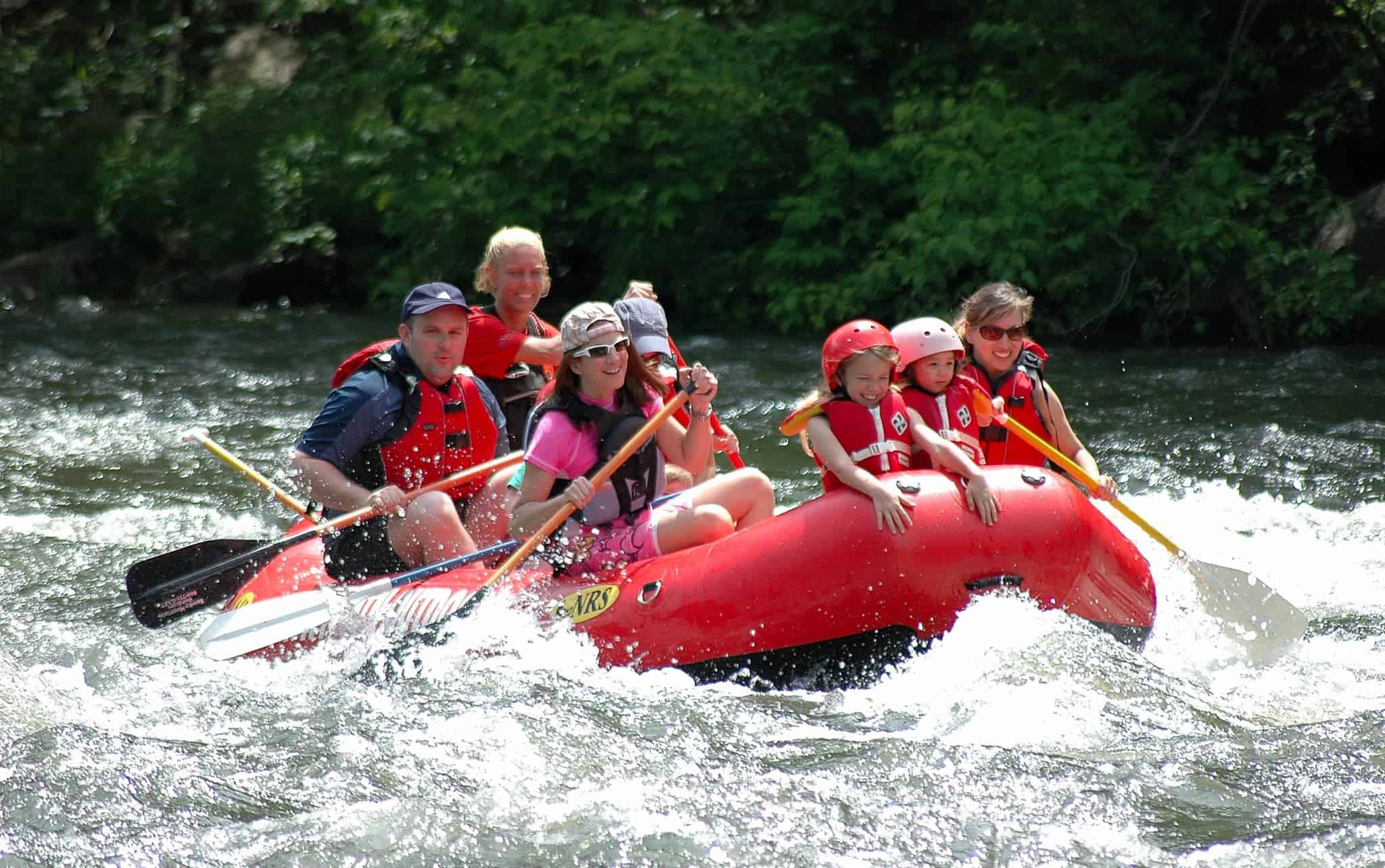 Family enjoying rafting trip in Smoky Mountains
