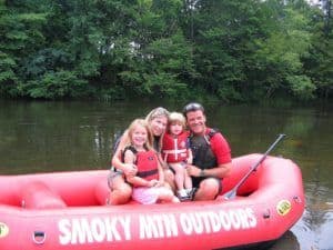 Happy family going rafting with Smoky Mountain Outdoors
