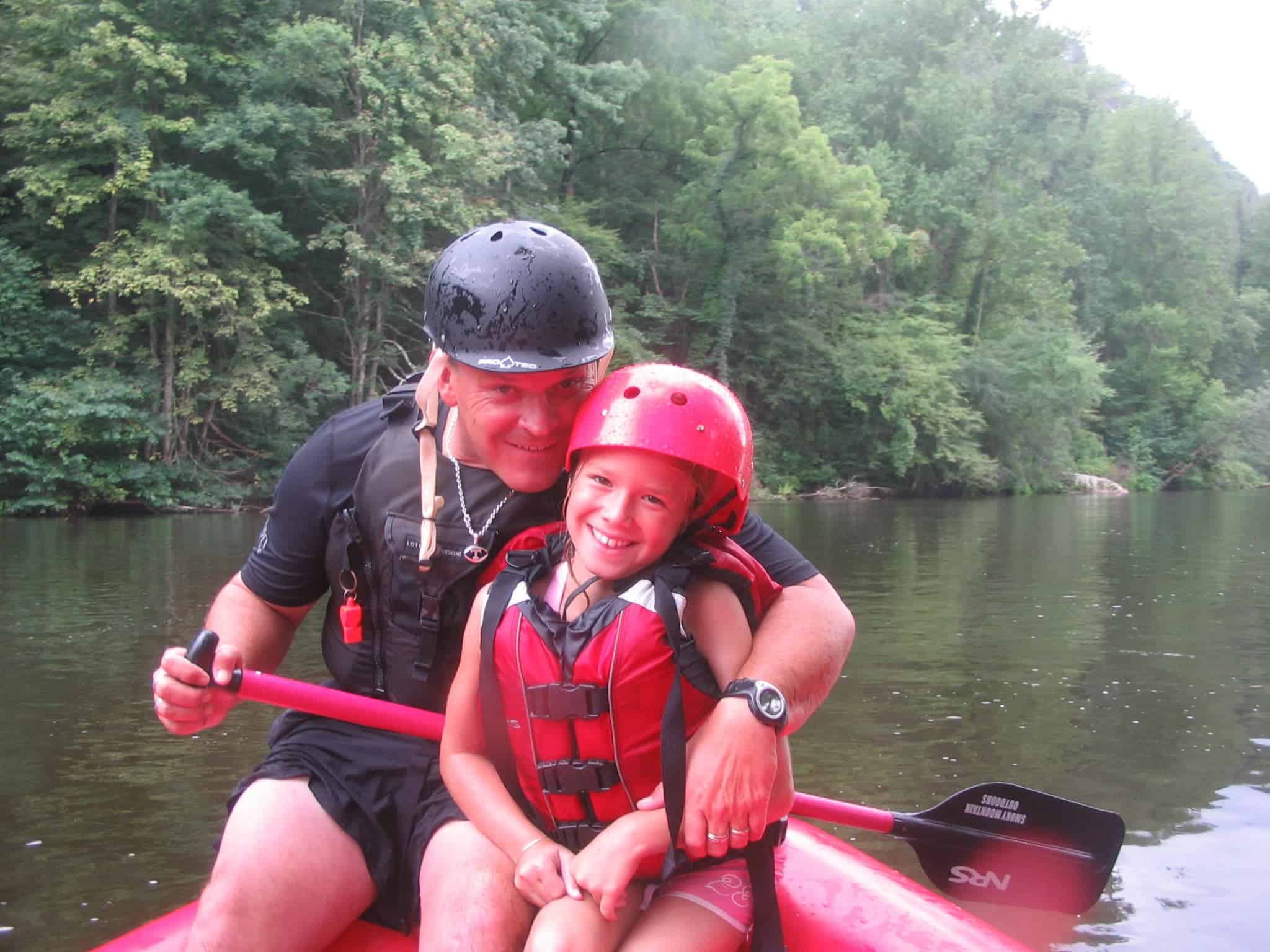 Young girl with rafting guide