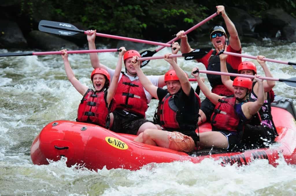 Rafters with paddles in the air