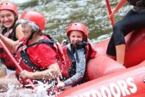 Smiling family on rafting trip