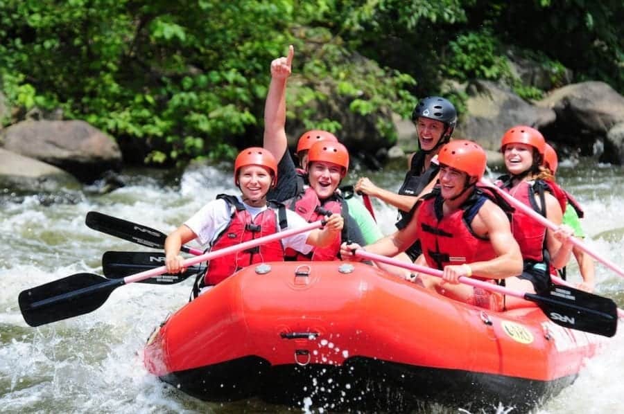 happy family on a pigeon river rafting trip